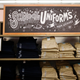 A stack of school uniforms are seen on the shelves inside the Old Navy clothing shop during a "ChildSpree" back-to-school shopping event in San Jose, August 3, 2013. The event, hosted annually by the Salvation Army, provides 100 children in need of economic assistance, $100 each to shop for new clothes in preparation for the upcoming school year, according to a representative from the organization. REUTERS/Stephen Lam (UNITED STATES - Tags: BUSINESS EDUCATION SOCIETY) - GM1E984056J01